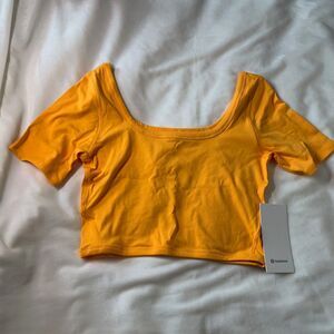 NWT Lululemon Gold Yellow Ribbed Held Tight Cropped Tee 10
